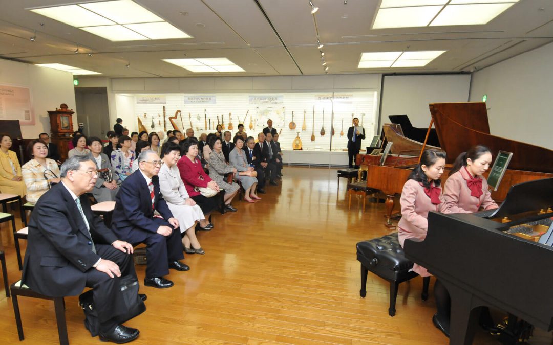 Guests at the opening ceremony enjoy the classical sounds of an antique fortepiano