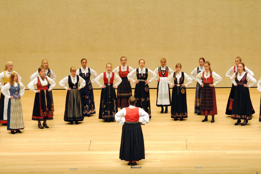 The Norwegian Girls Choir performing in traditional national costume